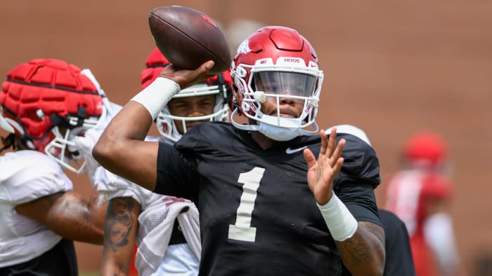 Razorbacks quarterback KJ Jefferson throws a pass in practice on the outdoor fields at the football center in Fayetteville, Arkansas.